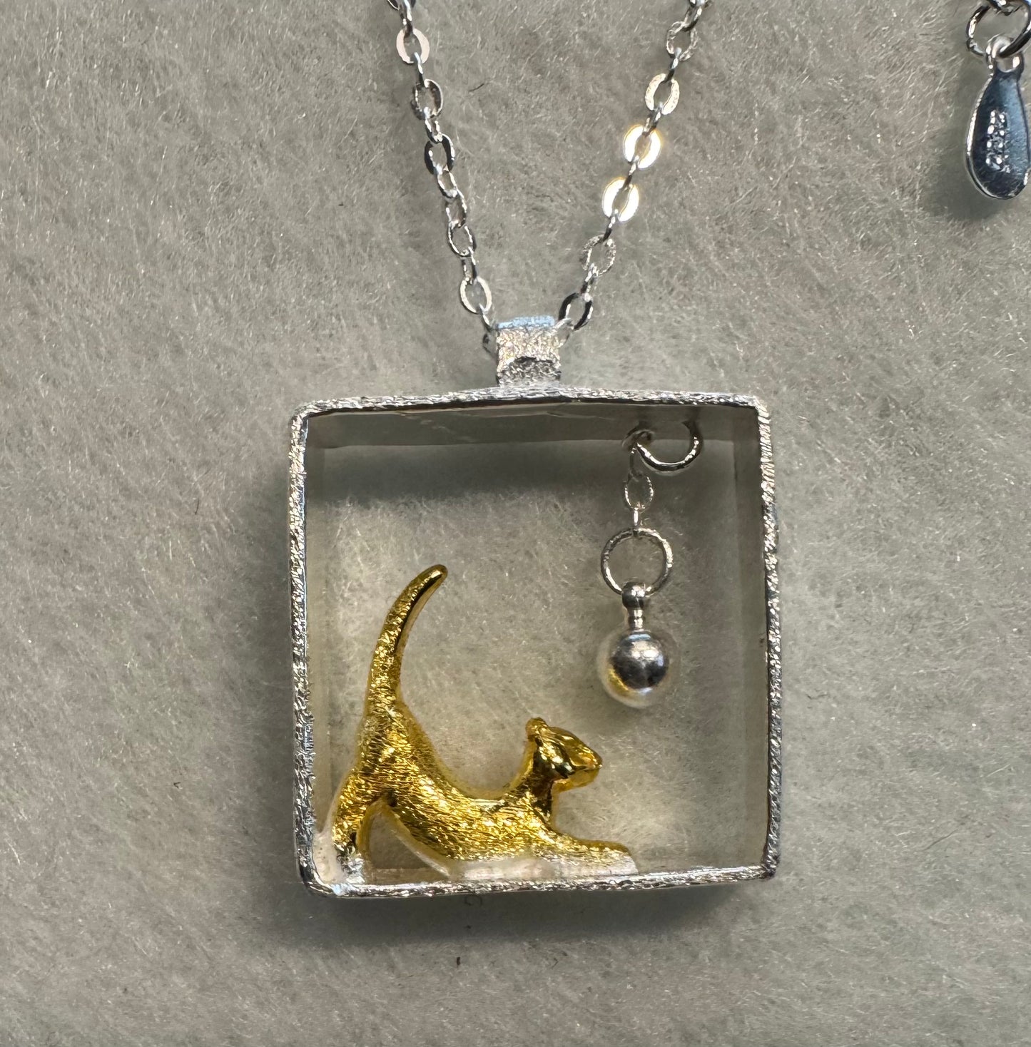 Cat necklace with hanging ball