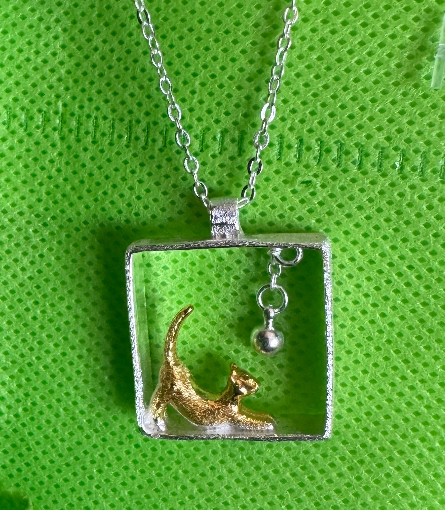Cat necklace with hanging ball