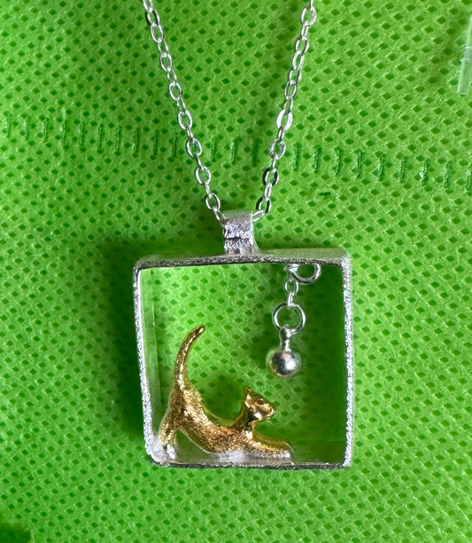Cat necklace with hanging ball